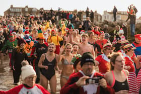 Hundreds go into the water at the New Year's Day Dip in Morecambe Bay. Picture by Richard Hislop.