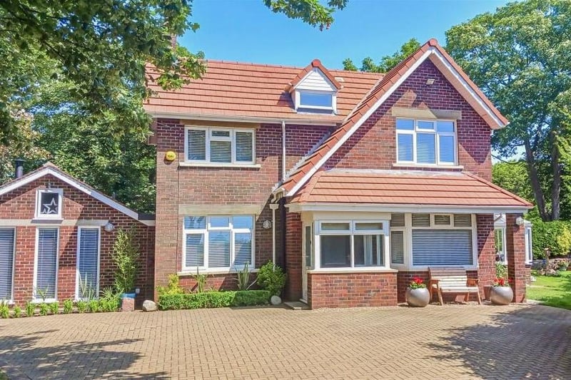 The detached family home is tucked back in a quiet and leafy location.