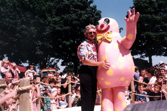 Noel Edmonds gives his creation 'Mr Blobby' a hug during the opening of Crinkley Bottom at Happy Mount Park in Morecambe
