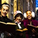 Carolers singing in A Christmas Carol to be performed at The Dukes in Lancaster. Picture by Gabi Dawkins.