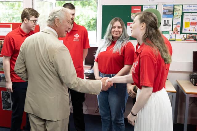 The Prince of Wales meets Charlotte during his visit to Morecambe Community Fire Station to view the work of The Princes’ Trust and the Lancashire Fire and Rescue Service.