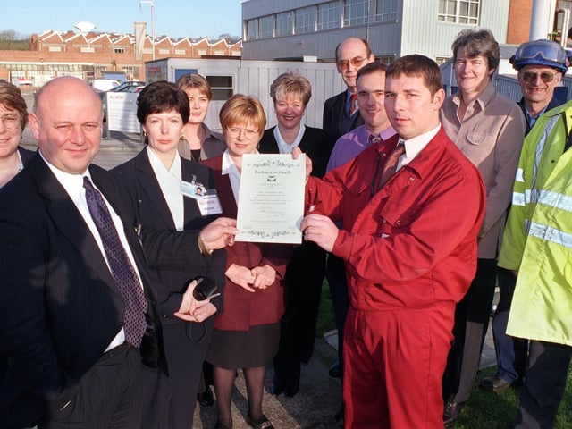 Dr Stephen Horsley (second left) presents the Morecambe Bay Health Promotions' Partners in Health Certificate to Shift Manager at Acordis, Lancaster, Adrian Swindells.