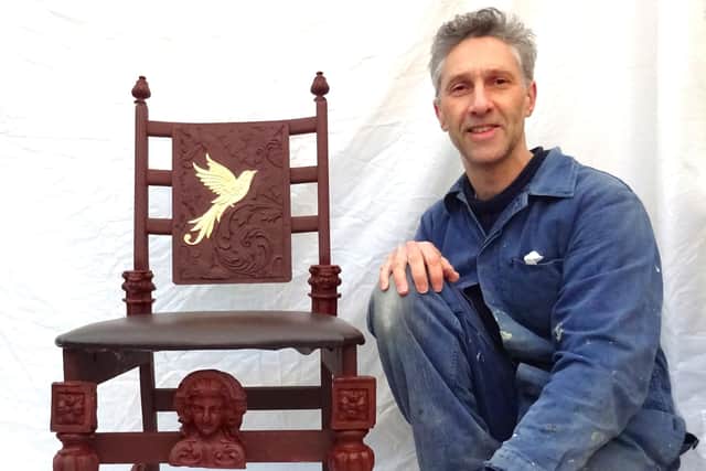 Artist Anthony Padgett with an upcycled chair.