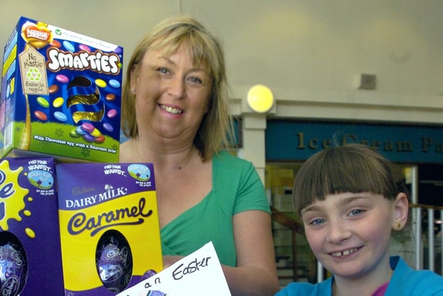 Winner of the Lancaster and Morecambe Newspapers 'Design an Easter Egg' competition sponsored by the Arndale Centre, Morecambe, Mia Bainbridge, eight, from Lancaster, receives her prize of Easter eggs, cinema tickets and beauty products from Arndale Centre manager Marie Needham.