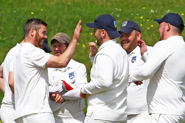Lancaster celebrate one of Liam Moffat's four wickets against Blackpool Picture: Tony North