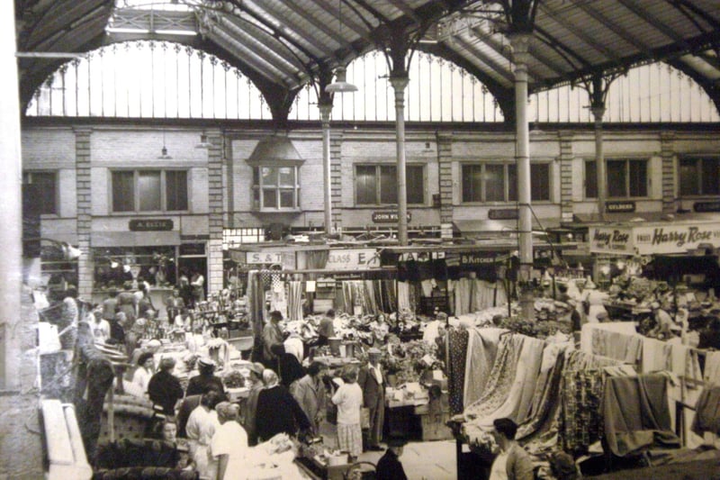 The old market hall packed with stalls, in Common Garden Street.