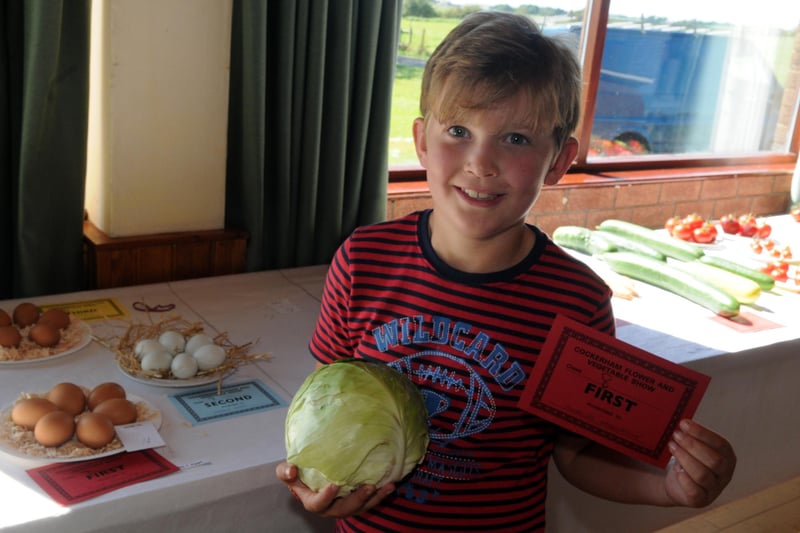 Charles Henderson, eight, from Cockerham, with his cabbage which won 1st at Cockerham Village Show in 2014.