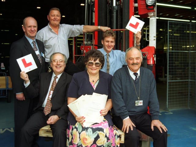 Forklift truck 'learner' drivers, David Longhorn, Hugh Short and Tony Capp, workers from Heysham 2 power station, with principal of Lancaster and Morecambe College David Roddam and NVQ consultant co-ordinator Jean Jacobs.