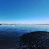 A view across Morecambe Bay with a calm sea.