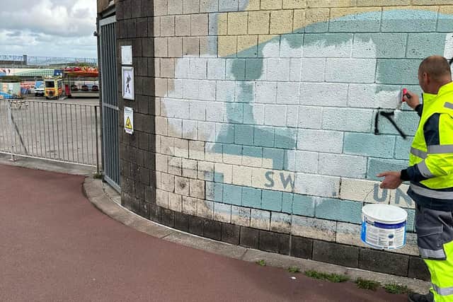 The graffiti was quickly removed or covered up by the city council. Photo by Joanne Ainscough