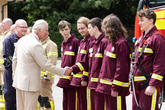 The Prince of Wales meets young people from Team during his visit to Morecambe Community Fire Station to view the work of The Princes’ Trust and the Lancashire Fire and Rescue Service.