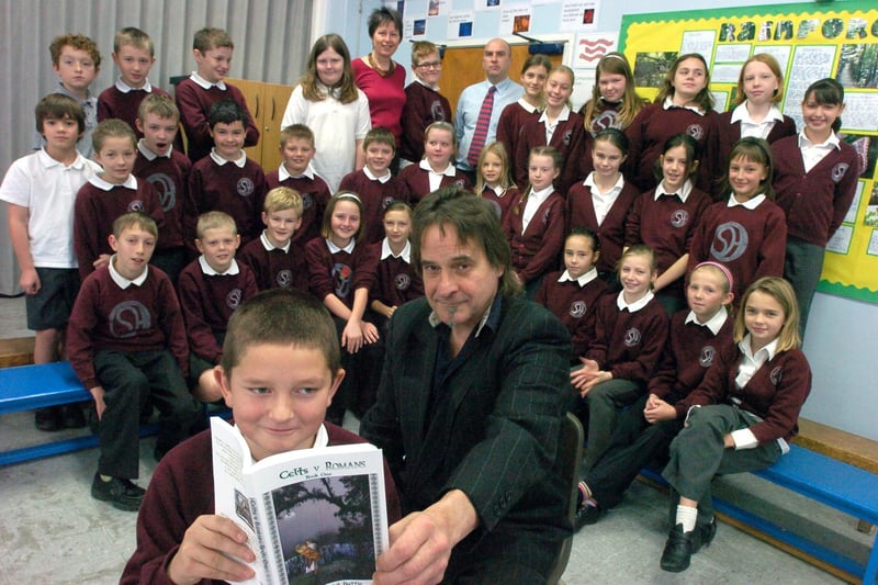 Morecambe author Stephen 'Conor' Kerensky visits Slyne's St Luke's CE School to Year 6 pupils including Kyle Gill aged 10 (front) and their teacher Stephanie Tulej with a copy of his new book 'Celts v Romans'. Also pictured is deputy head David Atkinson.