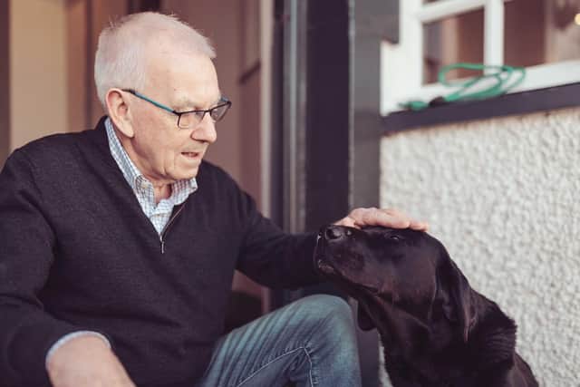 Longands owner Barry Robinson and dog Joe. Photo: Random Chair Ltd