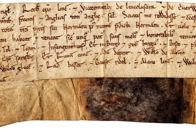 Part of the oldest document in the Lancashire Archives  – a charter of Henry I dating from 1115