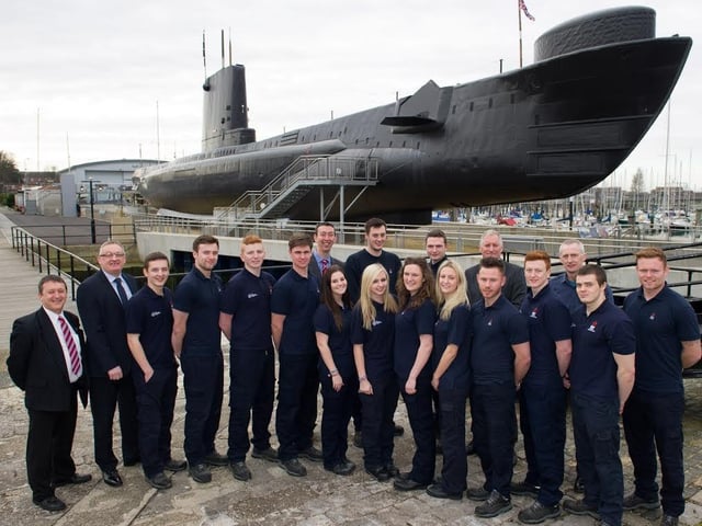 Heysham power station apprentices with managers from the site.