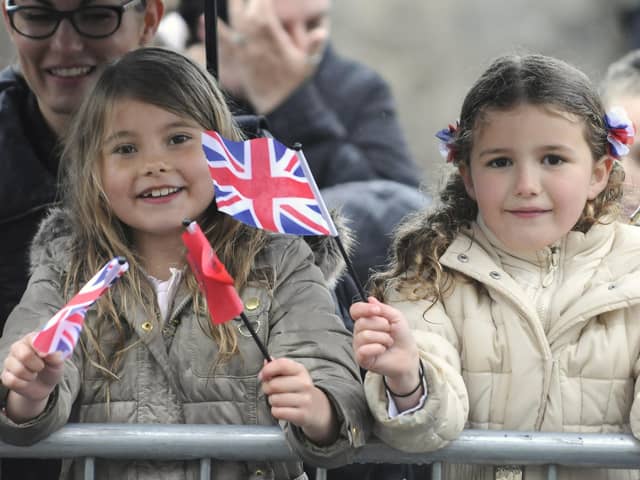 Youngsters wait for a glimpse of the Queen during her visit to Lancaster and Bilsborrow in 2015.