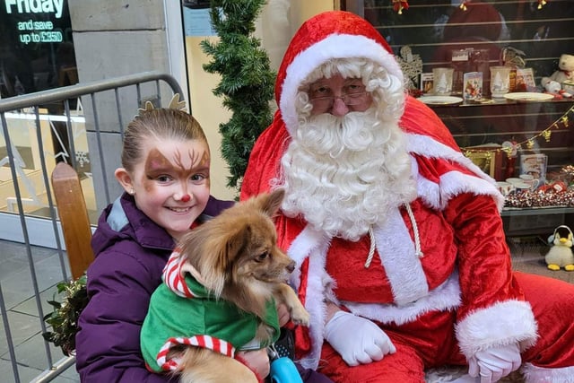Jessica and her dog Fudge meet Father Christmas.