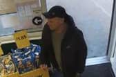 Police want to speak to this man in connection with an investigation into a robbery in Lancaster.
