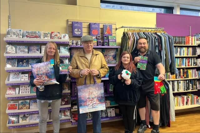 Dot Shuttleworth, lead volunteer, Alan Broughton, shop floor and till volunteer supporting Scope for over 15 years, Alison Goodman, shop manager and Tim MacKenzie, van driver at Scope in Lancaster.