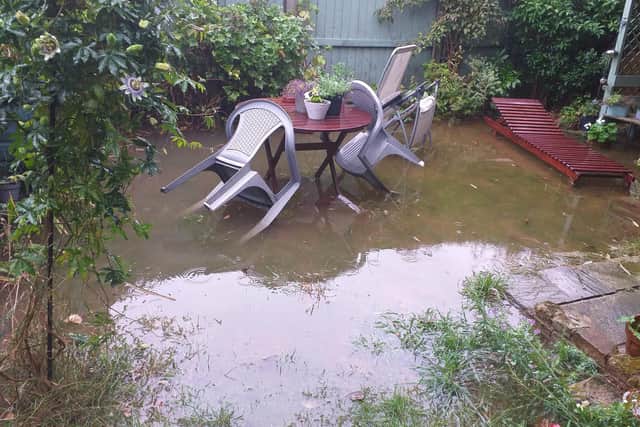 Flooding in a back garden on Willow Lane.