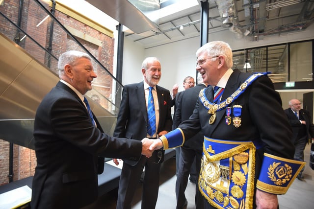 The Provincial Grand Master Anthony Harrison, right, greets guests.