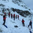Rescue teams on the mountain rescuing Ben Longton from Lancaster.