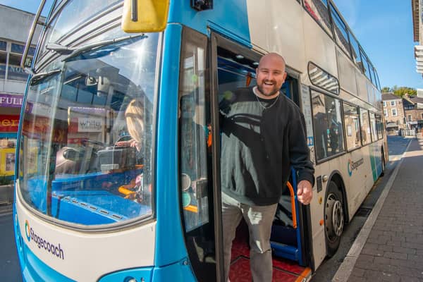 Pete Otway entertains the bus passengers of Lancaster on World Car Free Day.
