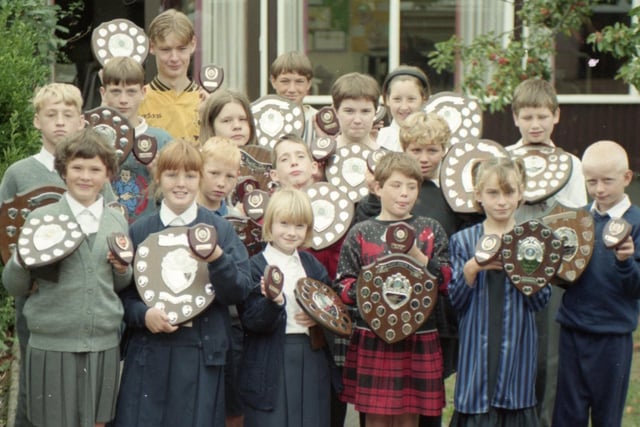 Good deeds and hard study have been rewarded in a prizegiving ceremony at Morecambe Road School in Morecambe. Among the prizes to pupils were shields for progress, helpfulness and cheerfulness. Pictured are some of the prize winners with their shields and trophies