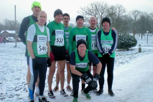 The Lytham Road Runners mens team prepare for a cold run in the snow in 2009