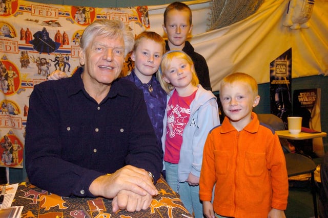 Star Wars actor Dave Prowse, who played the part of Darth Vader, with Lee and Rebecca Hawkesford and Joshua and Thomas Barry at a Star Wars Convention at Lancaster & Morecambe College.