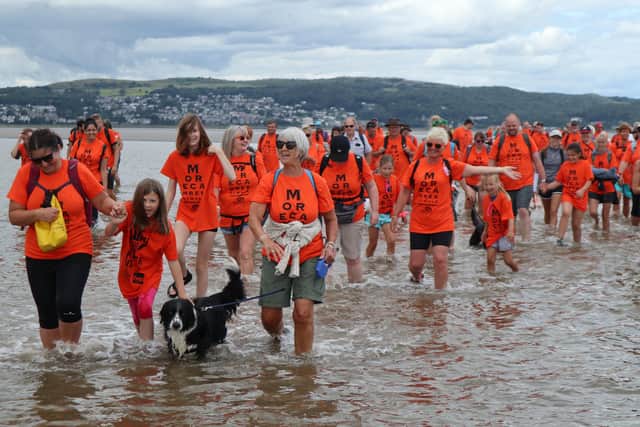 Supporters of Galloway’s taking part in the walk across Morecambe Bay in 2021.