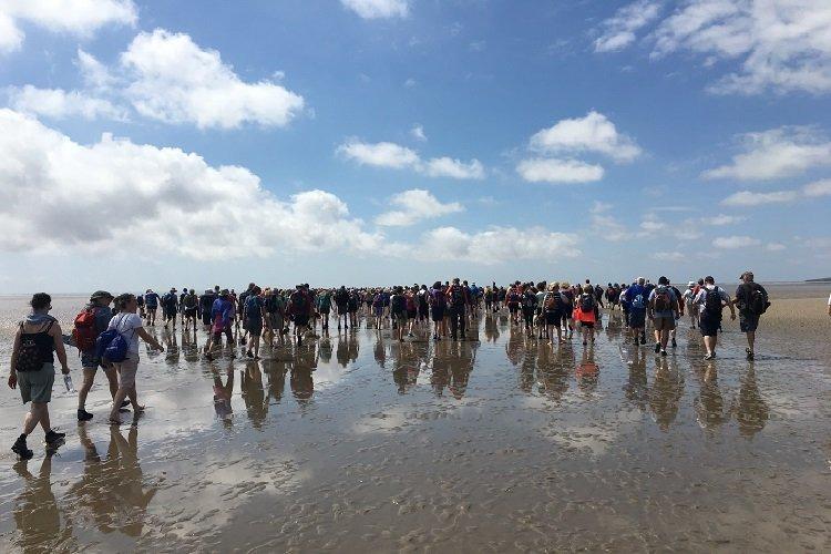 People have been crossing the sands of Morecambe Bay with a royally appointed guide since the 1500s. Taking part in a Cross Bay Walk is a unique and exceptional way to enjoy the stunning beauty of the bay. Crossing the sands with an experienced and knowledgeable Queen's Guide is the only safe way to traverse the ever-changing flats and treacherous channels.