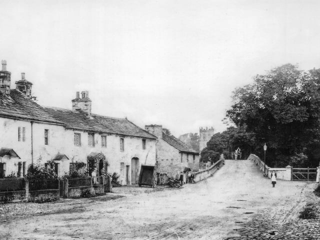 Main Street, Hornby, 1911. The cottage to the left of the bridge was flooded to a depth of five feet. Photo: David Kenyon.
