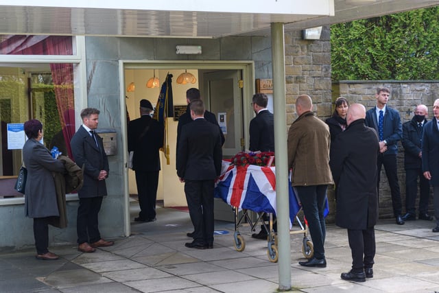 Jack Bracewell's coffin is taken into the crematorium.
