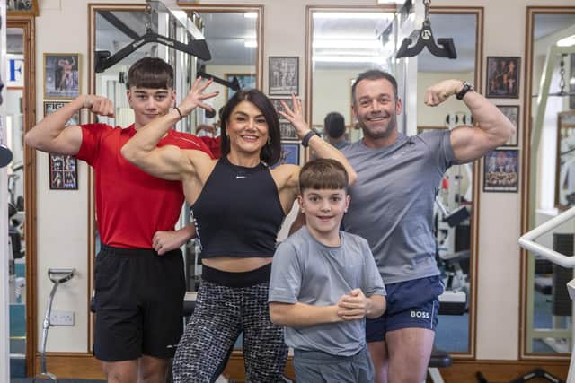 Bodybuilding family, Kerry MacDonald, 43, Steven Johnston, 47, Oliver, 14 and Aaron, 11 training at Ted's Gym in Workington, Cumbria.