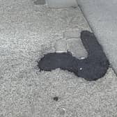 An example of the 'blobbing' technique of pothole-filling - but will repairs like this last?
