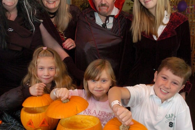 Mia Cooper-Wright, Natalie and Thomas Preston with Happy Mount Park staff and helpers, Sheila Rastelli, Ray Bleasdale, Shirley Thornley and Torun McMoran, at a pumpkin carving workshop.