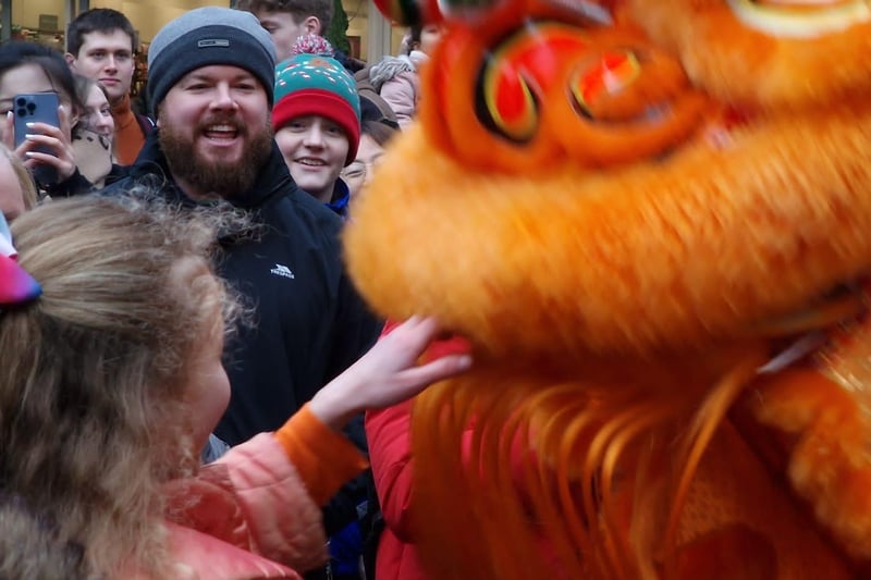 The crowd gets up close with the Chinese New Year lion.