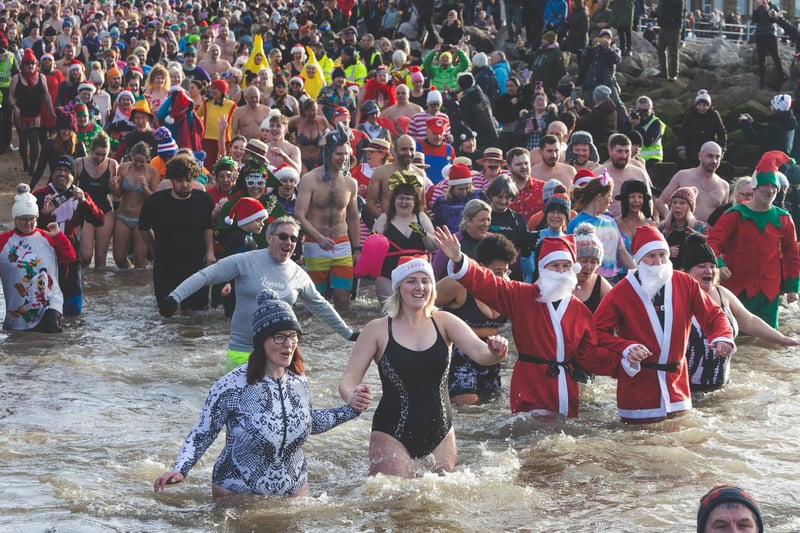 Hundreds braved the freezing water for the New Year's Day Dip in Morecambe Bay.