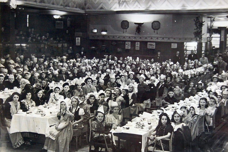 Hundreds of children assembled at the Central Pier for a party to celebrate the end of World War II in 1945.