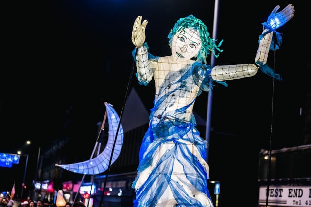 The large puppet of a lady lit up for the lantern procession in the West End of Morecambe.