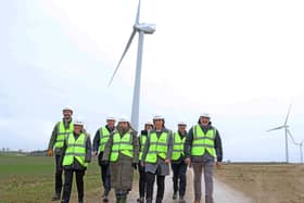 The OnPath energy team near one of the wind turbines.