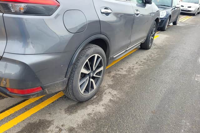 Cars parking back on the newly repainted yellow lines in Whitegate.