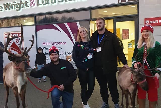 Christmas Market organiser, Clare Lyden, centre, with partner, Jack Taylor and the reindeer handlers.