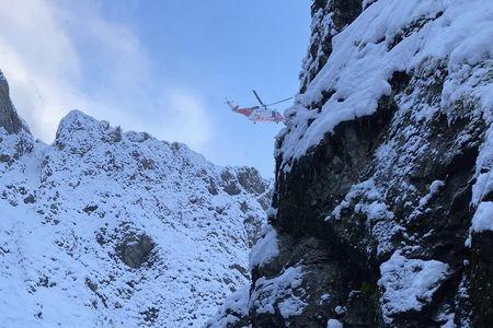 A helicopter can be seen flying above the gully where Ben Longton was stranded.
