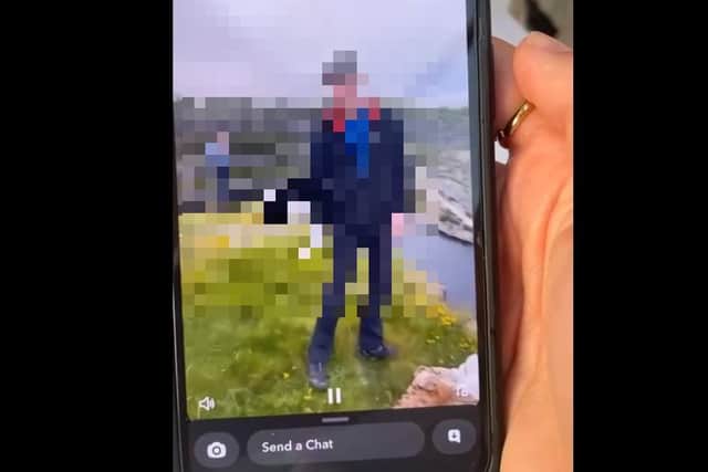 The Snapchat showing the male about to throw the cat off a cliff which we have partially obscured because it could be too upsetting to view.