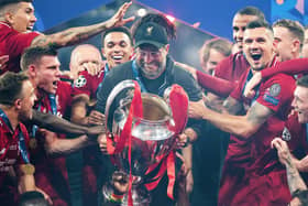 Liverpool FC manager Jurgen Klopp celebrates with the Champions League trophy after winning the UEFA Champions League Final between Tottenham Hotspur and Liverpool at Estadio Wanda Metropolitano on June 1 2019 in Madrid, Spain. Photo by Matthias Hangst/Getty Images