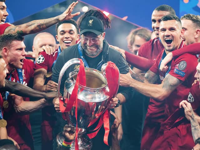 Liverpool FC manager Jurgen Klopp celebrates with the Champions League trophy after winning the UEFA Champions League Final between Tottenham Hotspur and Liverpool at Estadio Wanda Metropolitano on June 1 2019 in Madrid, Spain. Photo by Matthias Hangst/Getty Images