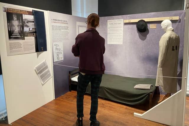 Site supervisor, Alex Hale in the display depicting the kind of accommodation provided to vagrants at Lancaster Workhouse.