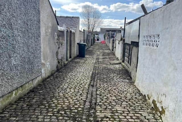 The back alley behind Windsor Road in Morecambe after it was cleared of weeds and rubbish.